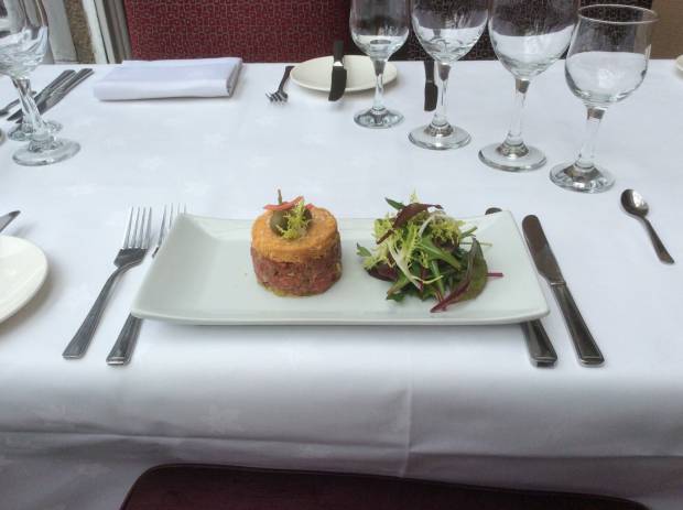 Tartare of pan-fried Beef, Parmesan Crumble, Baby Spinach Salad.