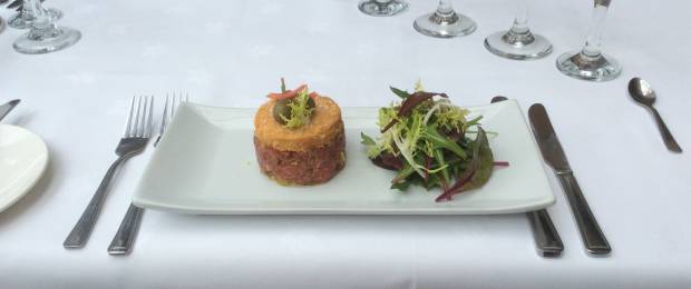 Tartare of pan-fried Beef, Parmesan Crumble, Baby Spinach Salad.